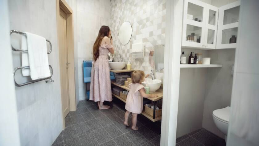 mother and child getting ready in bathroom